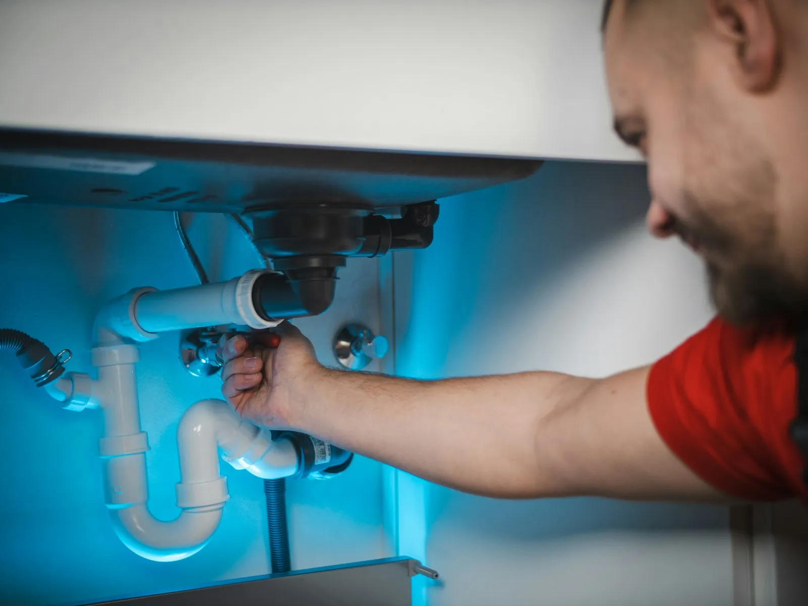 Plumber repairing pipes